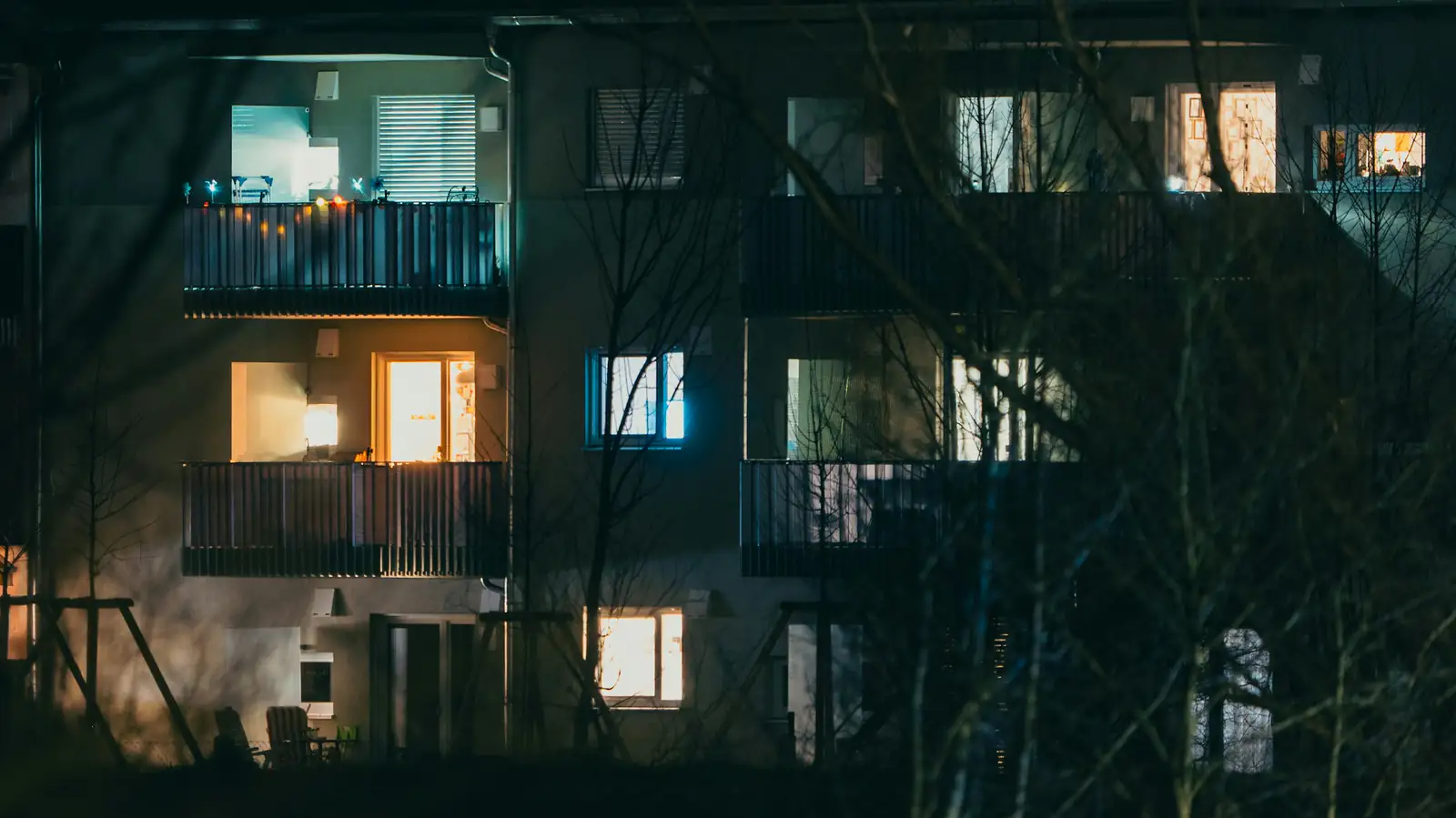 Apartment building balconies lit at night