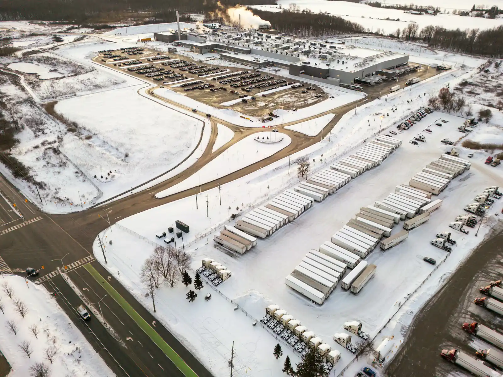 Aerial view of a distribution centre and truck yard in winter