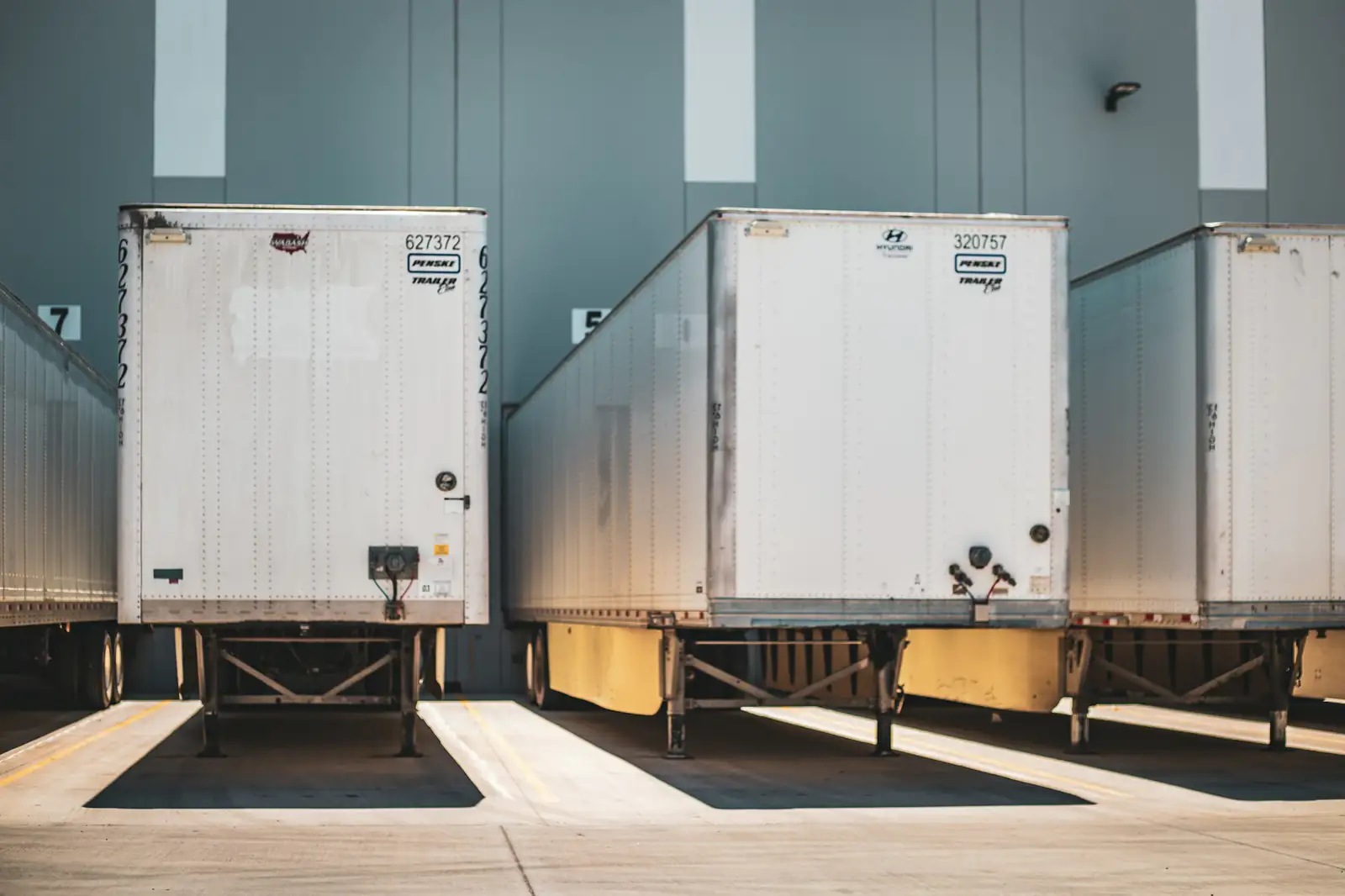 Trailers backed into a warehouse loading dock